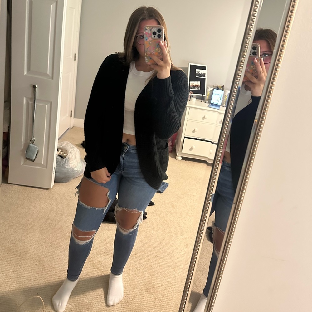 Medium length black sweater